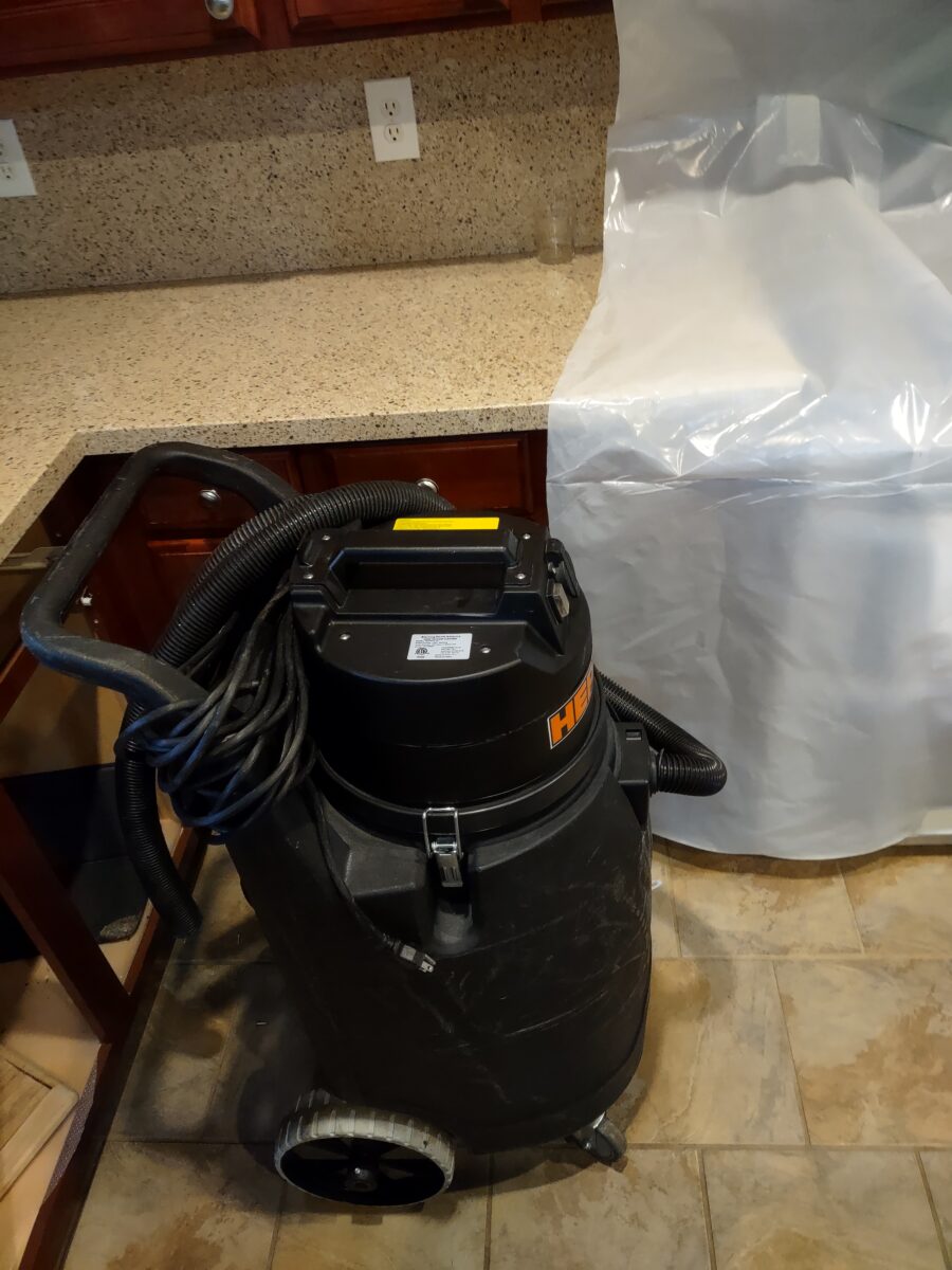 Professional attic mold removal technician in protective equipment