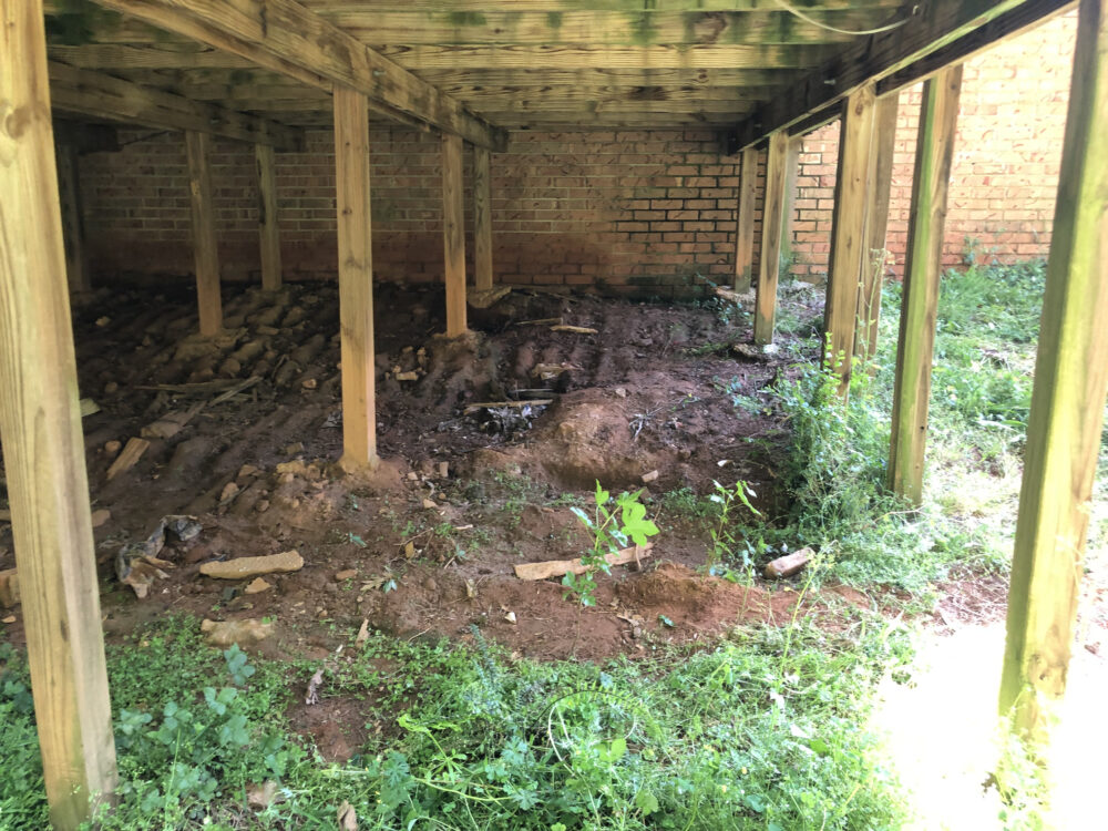 Raccoon feces and urine contamination in attic insulation requiring cleanup in Marietta GA