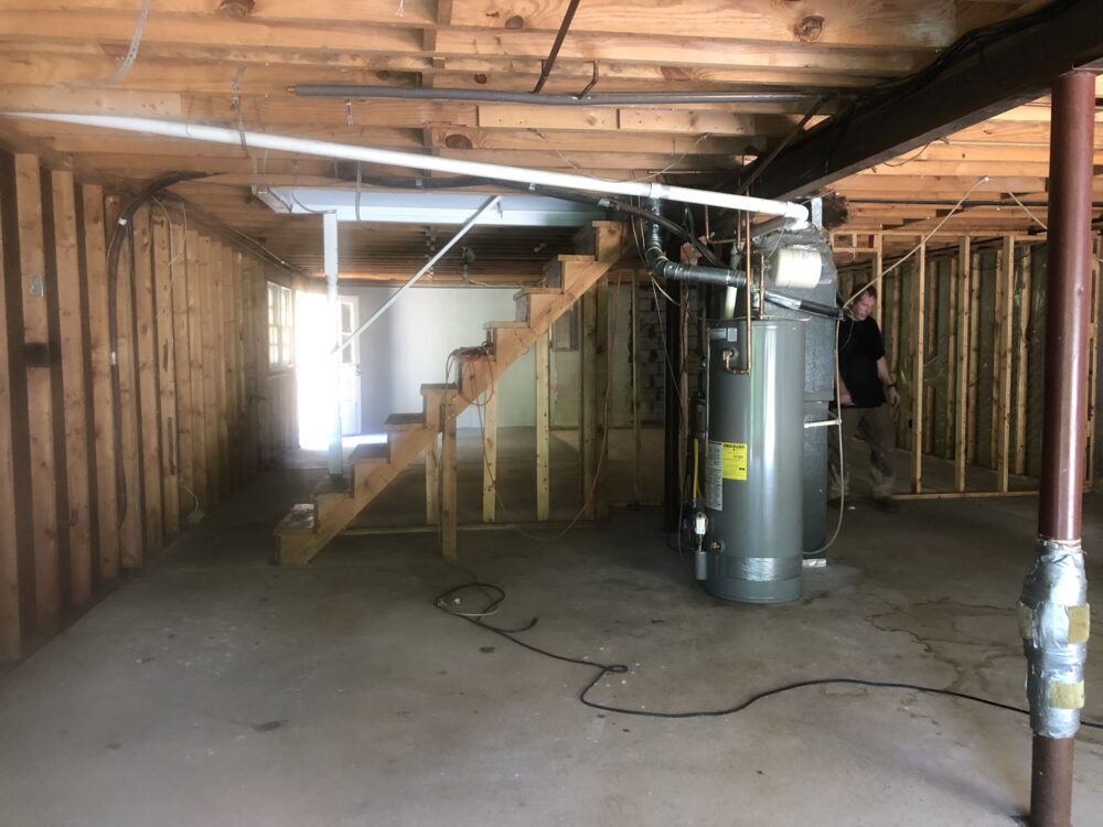 Hazmat-suited professionals conducting tear gas removal in Marietta Georgia facility