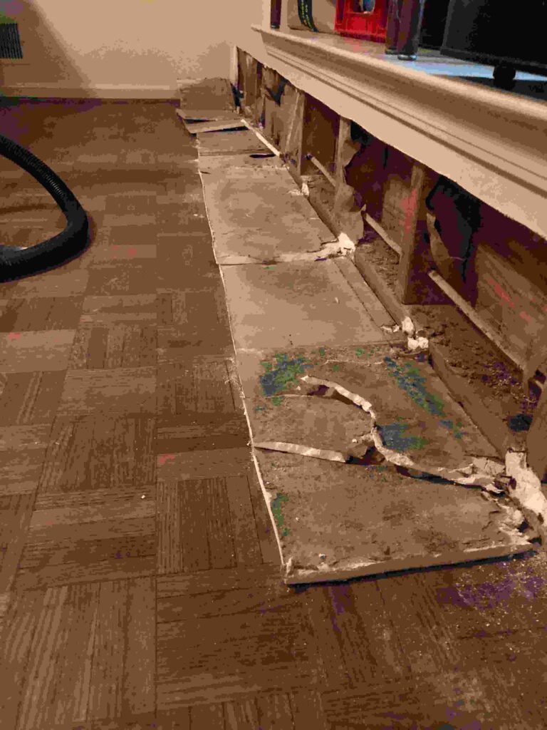 Flooring and baseboards torn out exposing the subfloor shows the consequence of delayed action landlords face