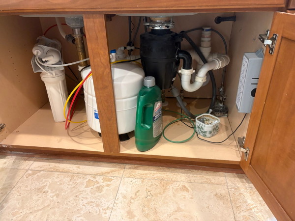 Water Damage Restoration of A Small Leak Under the Kitchen Sink and floor