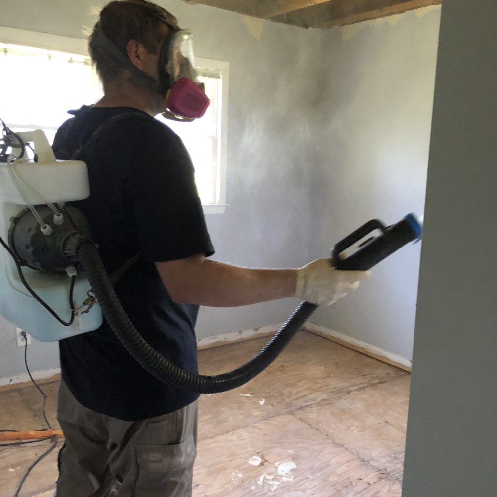 Technician performing professional drug lab cleanup and decontamination to restore a safe environment.