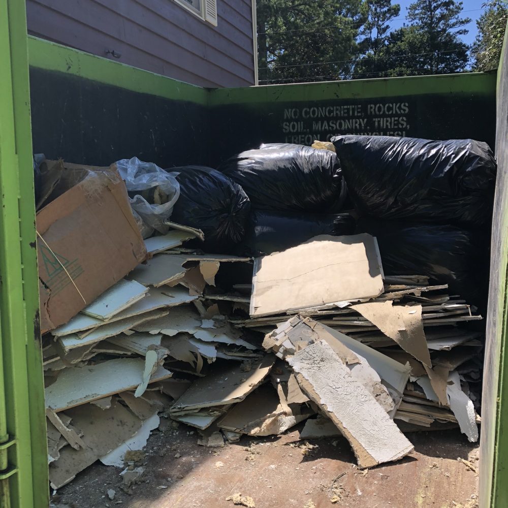 Certified cleanup crew in full PPE equipment performing rodent decontamination in Marietta Georgia