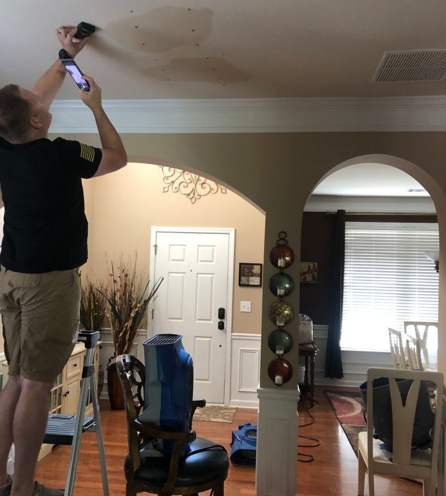 Water-damaged ceiling before professional moisture removal treatment